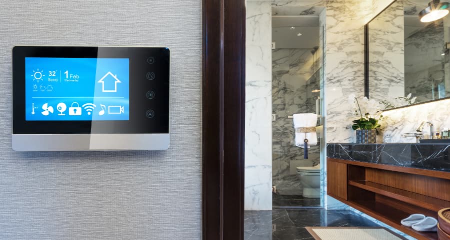 Smart home central touchscreen on wall outside bathroom